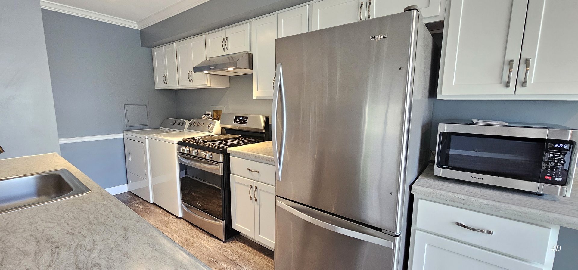 1497 Cornell Court Hoffman Estates, IL 60169 - Photo 12 of 30 a kitchen with stainless steel appliances a stove a refrigerator and cabinets