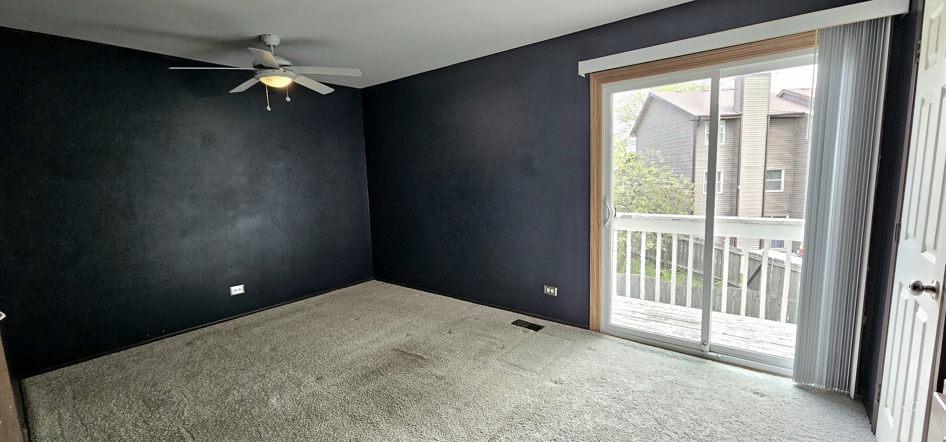 1497 Cornell Court Hoffman Estates, IL 60169 - Photo 14 of 30 a view of a livingroom with a ceiling fan and window