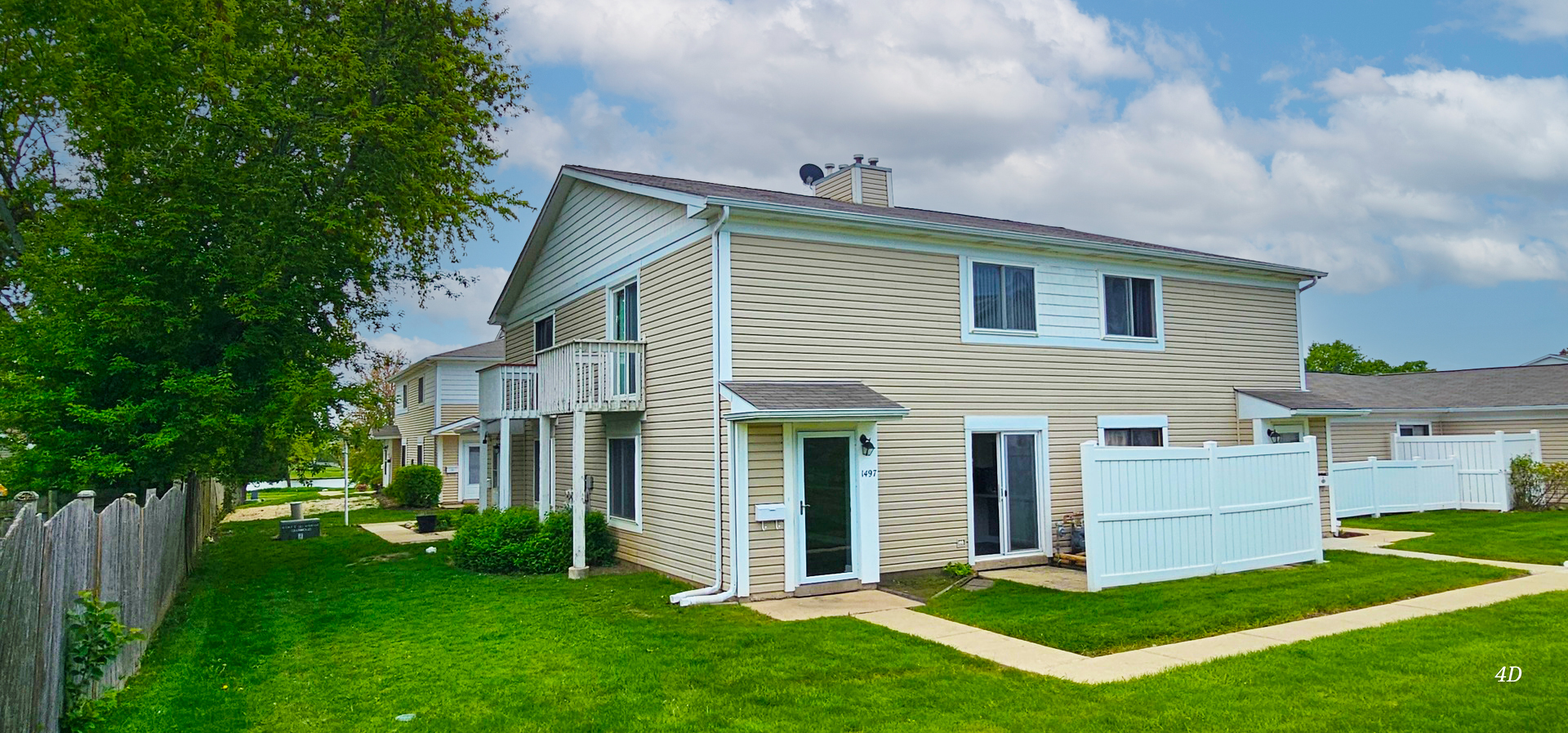 1497 Cornell Court Hoffman Estates, IL 60169 - Photo 2 of 30 a front view of a house with a garden