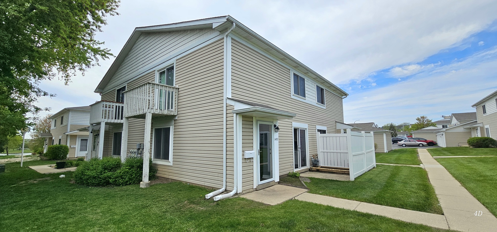 1497 Cornell Court Hoffman Estates, IL 60169 - Photo 27 of 30 a front view of a house with a yard