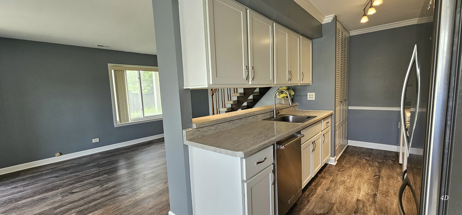 1497 Cornell Court Hoffman Estates, IL 60169 - Photo 6 of 30 a kitchen with stainless steel appliances granite countertop a sink and a refrigerator