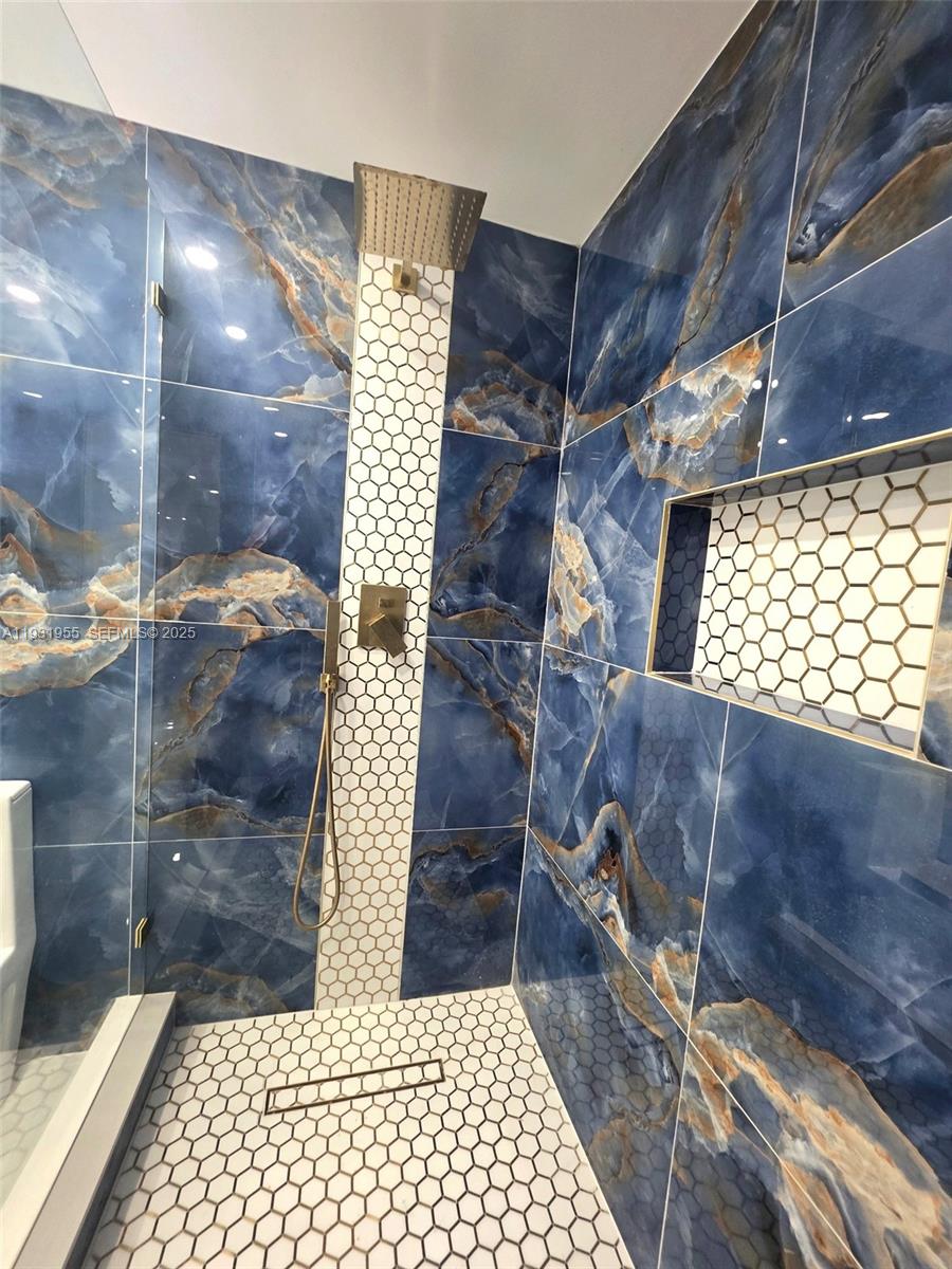 Davie Davie, FL 33314 - Photo 12 of 44 a bathroom with a shower