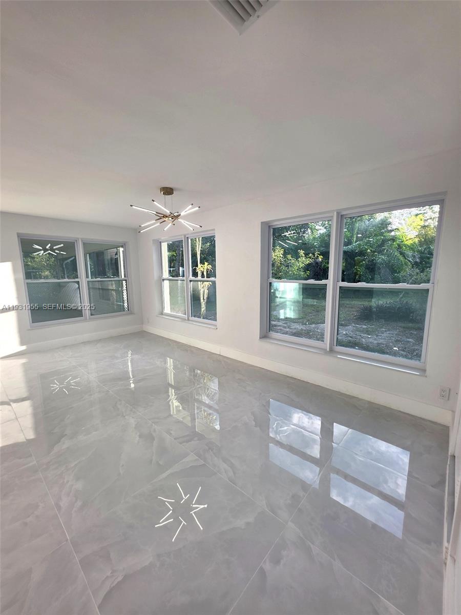 Davie Davie, FL 33314 - Photo 13 of 44 front view of a house with large windows