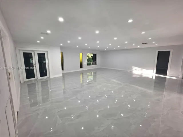 a bathroom with a sink and mirror with toilet