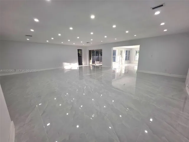 a bathroom with a sink a mirror and a vanity