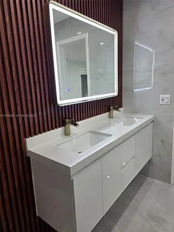 a white bath tub sitting in a bathroom