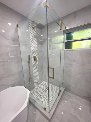 a bathroom with a bathtub and a sink