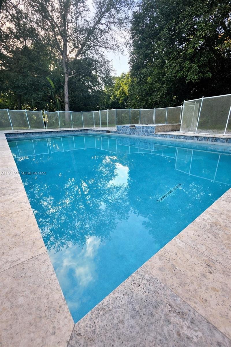 Davie Davie, FL 33314 - Photo 26 of 44 a view of a swimming pool with a yard