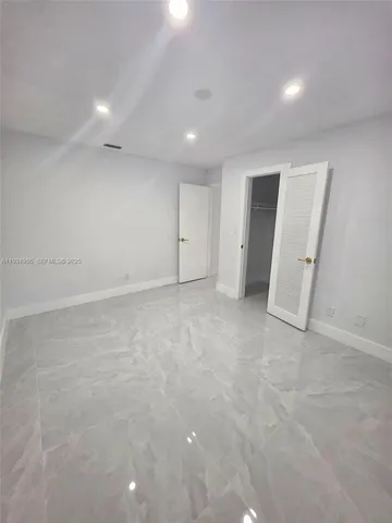 a view of a house with a tree in a yard