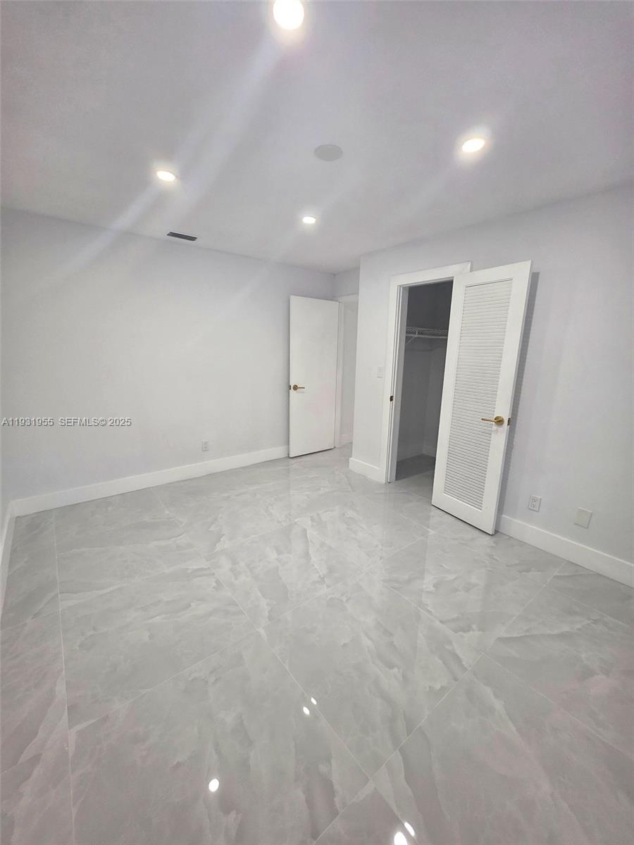 Davie Davie, FL 33314 - Photo 38 of 44 an empty room with a window