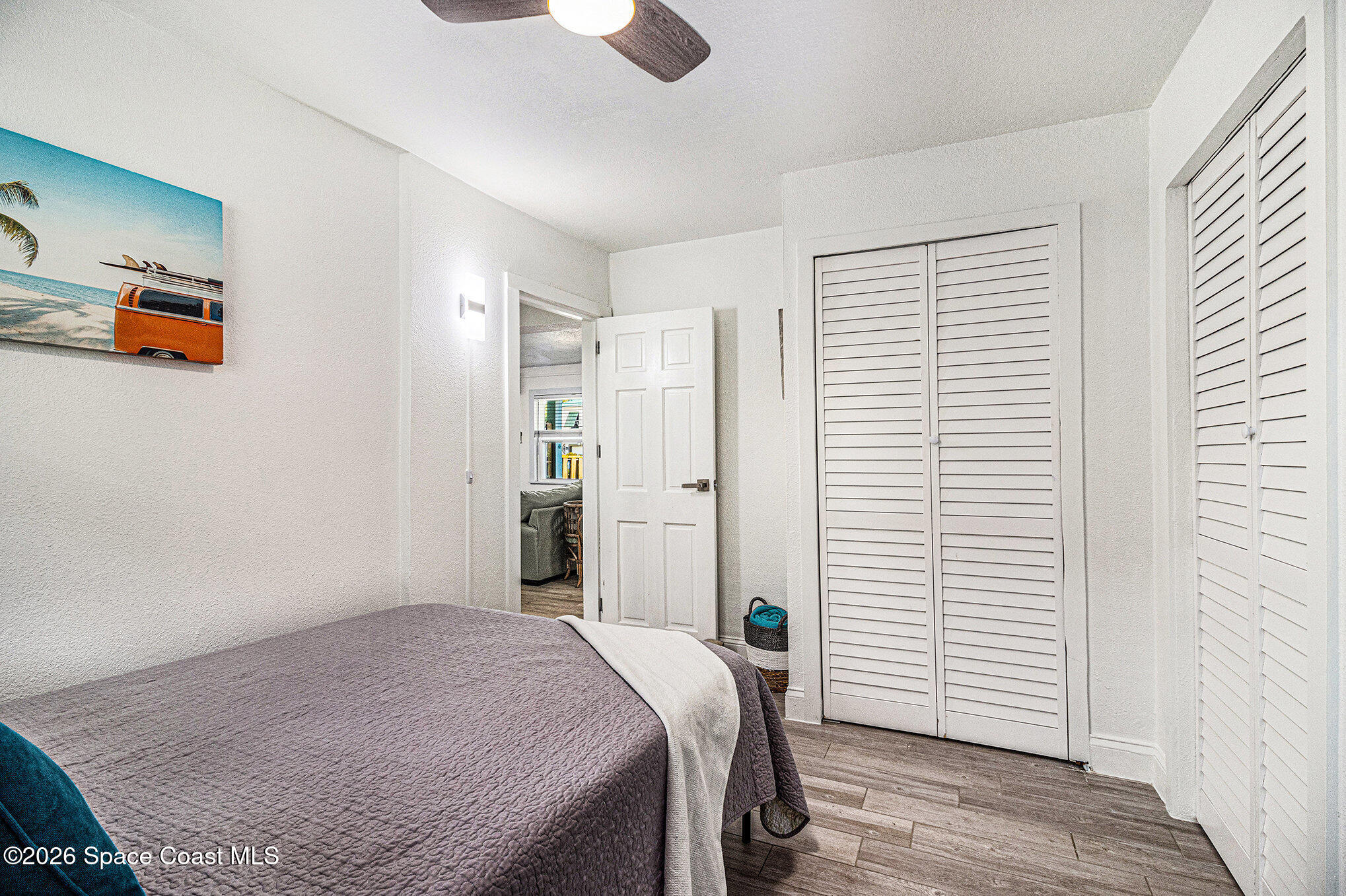 7605 Ridgewood Avenue, Unit 3 Cape Canaveral, FL 32920 - Photo 17 of 28 a bedroom with a bed and a window