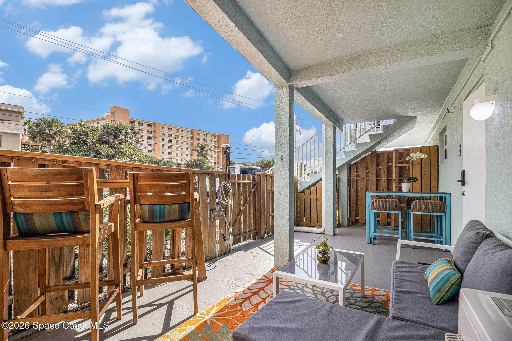 7605 Ridgewood Avenue, Unit 3 Cape Canaveral, FL 32920 - Photo 2 of 28 a view of balcony with couch