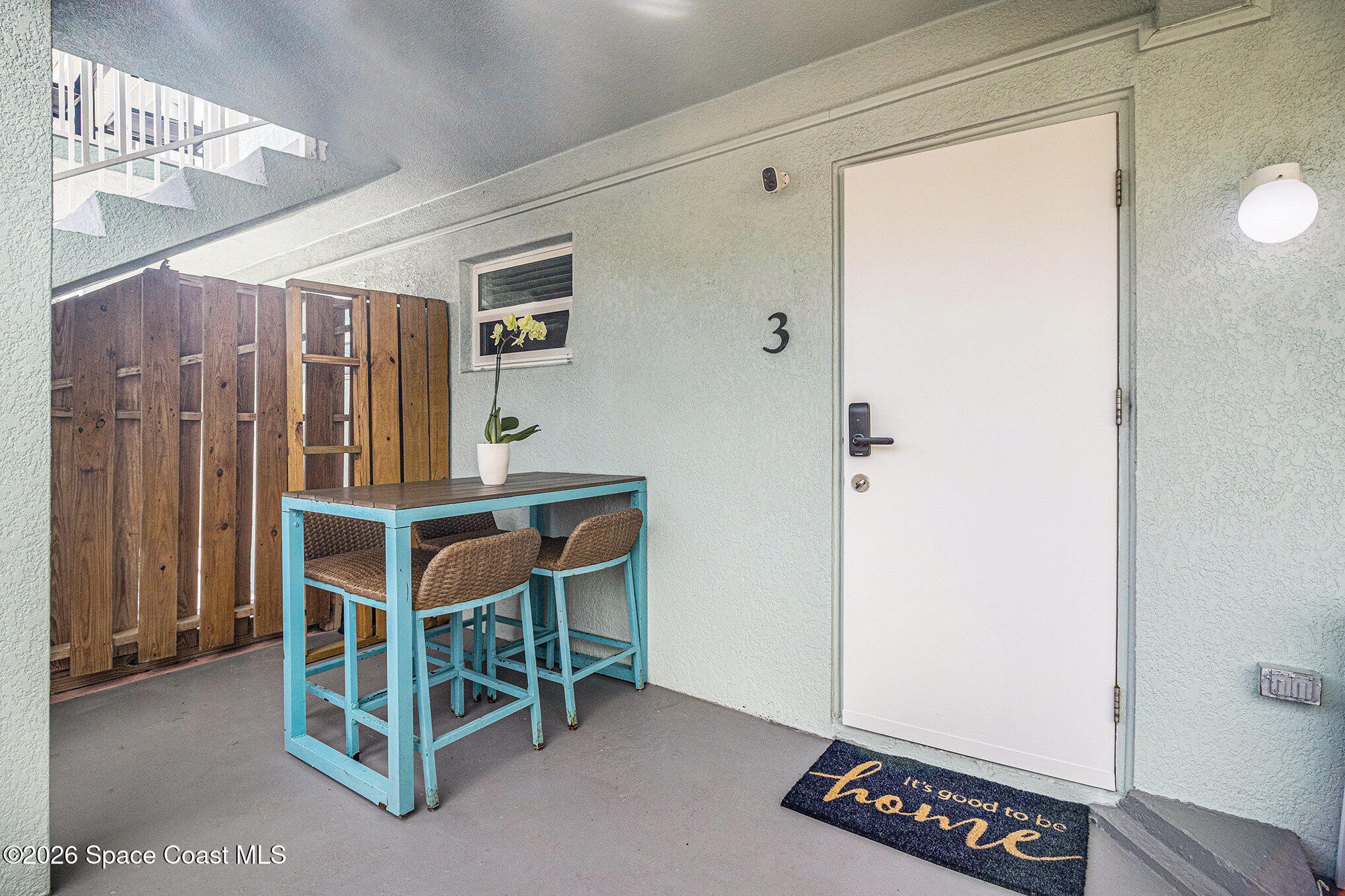 7605 Ridgewood Avenue, Unit 3 Cape Canaveral, FL 32920 - Photo 21 of 28 a view of an empty room with wooden floor