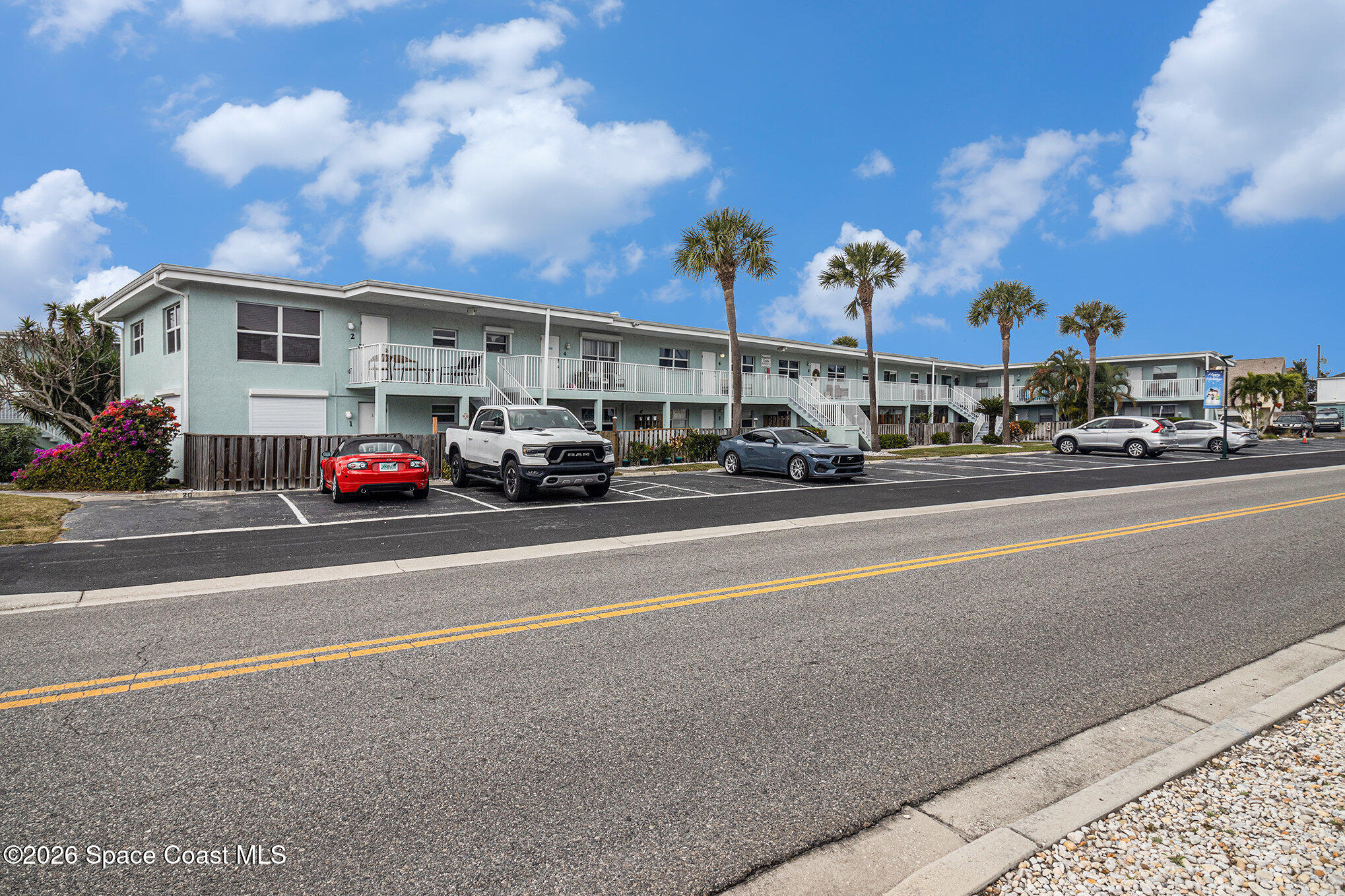 7605 Ridgewood Avenue, Unit 3 Cape Canaveral, FL 32920 - Photo 27 of 28 a view of street with parked cars