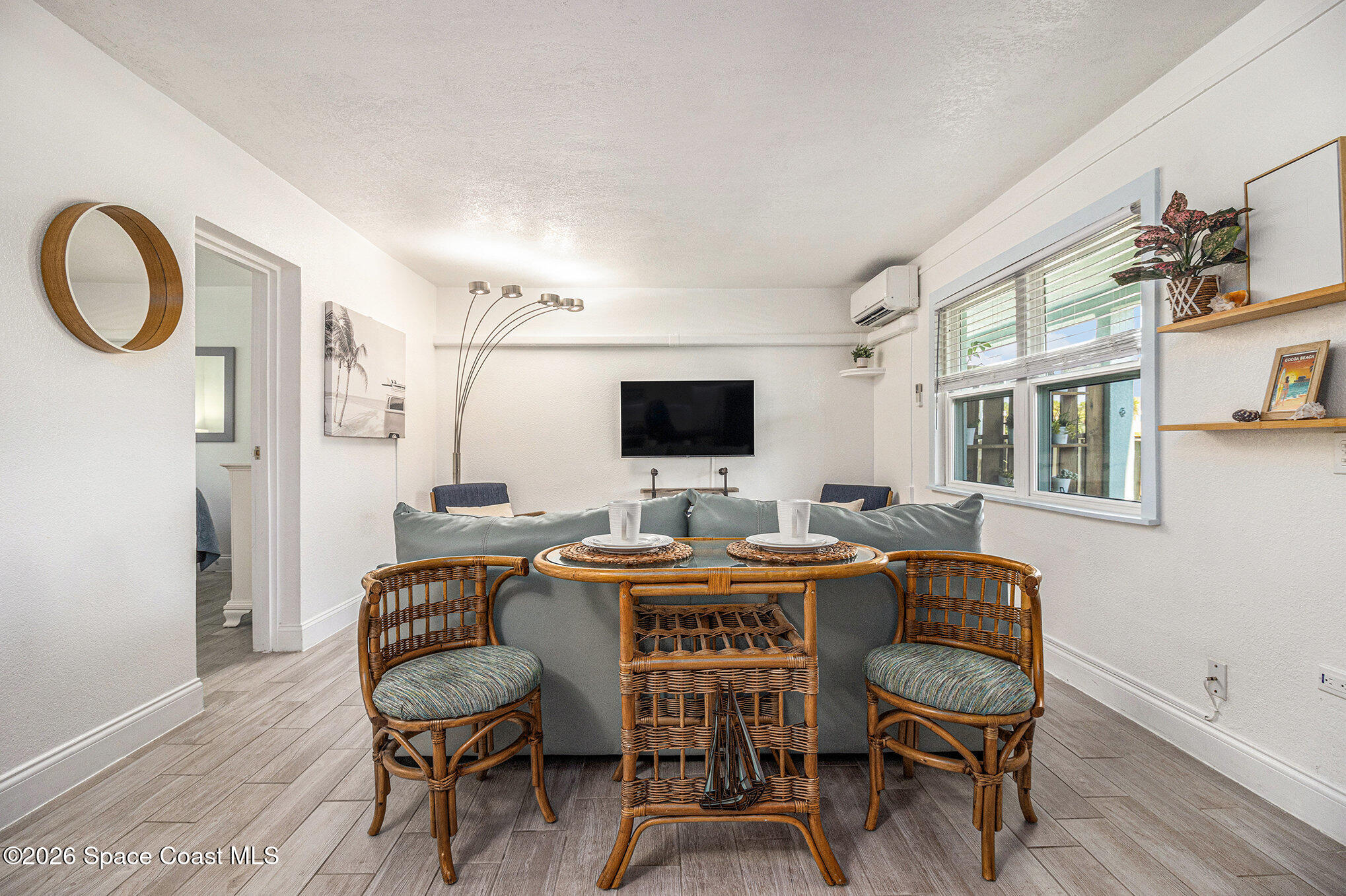 7605 Ridgewood Avenue, Unit 3 Cape Canaveral, FL 32920 - Photo 10 of 28 a view of a dining room with furniture and a window