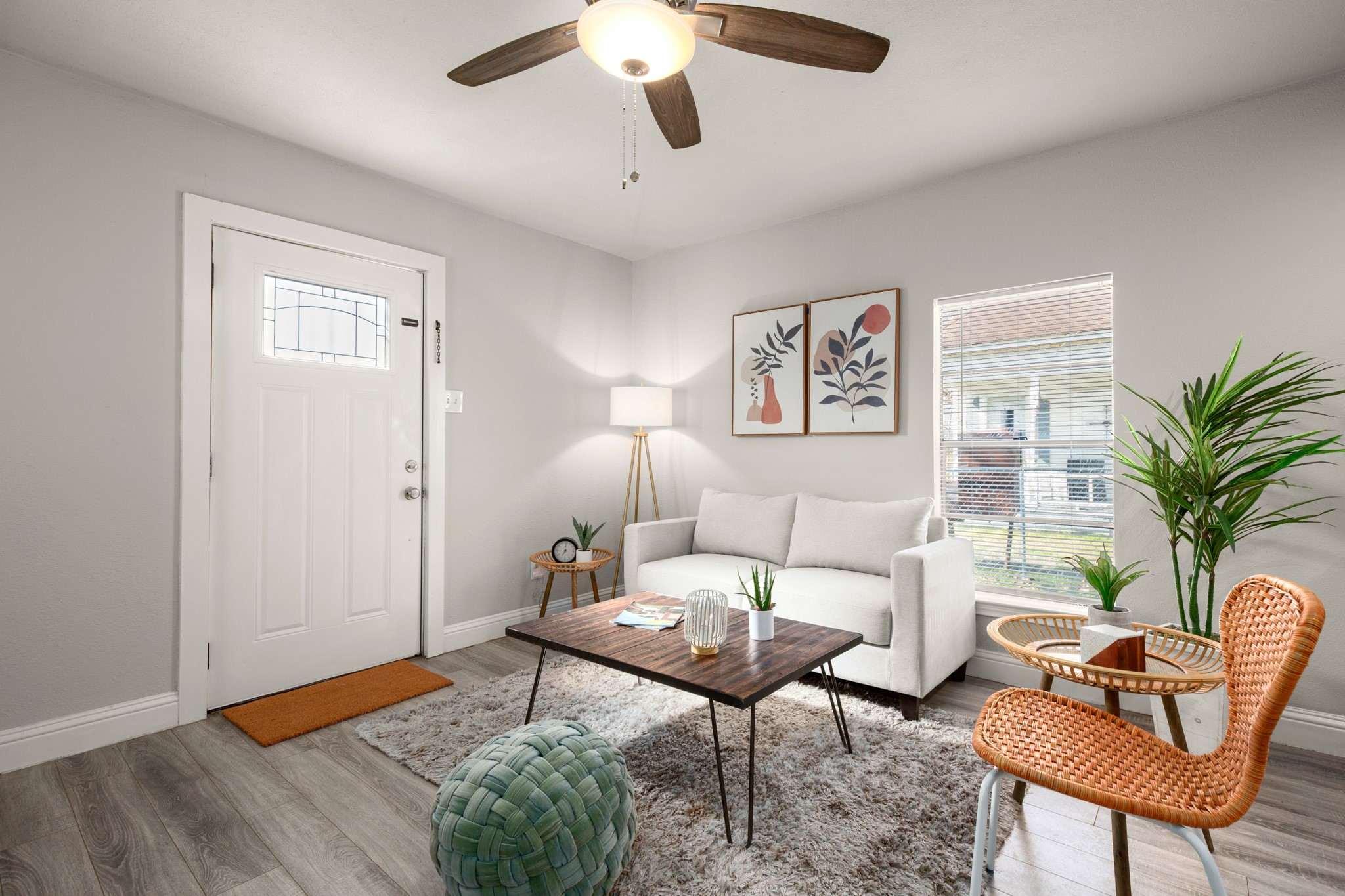 918 West 3rd Street Taylor, TX 76574 - Photo 6 of 22 Living area featuring light wood-style floors and ceiling fan