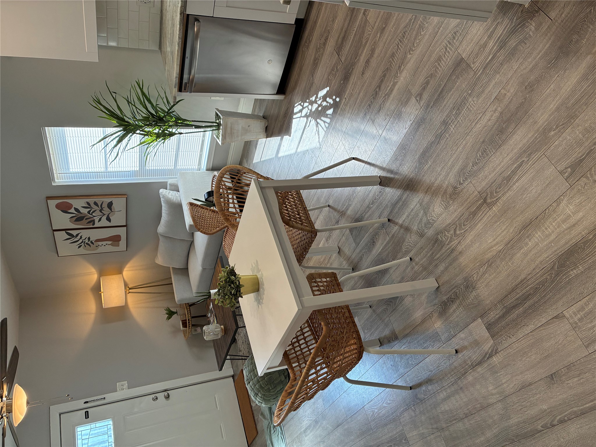 918 West 3rd Street Taylor, TX 76574 - Photo 10 of 22 Dining space with ceiling fan and light wood-type flooring
