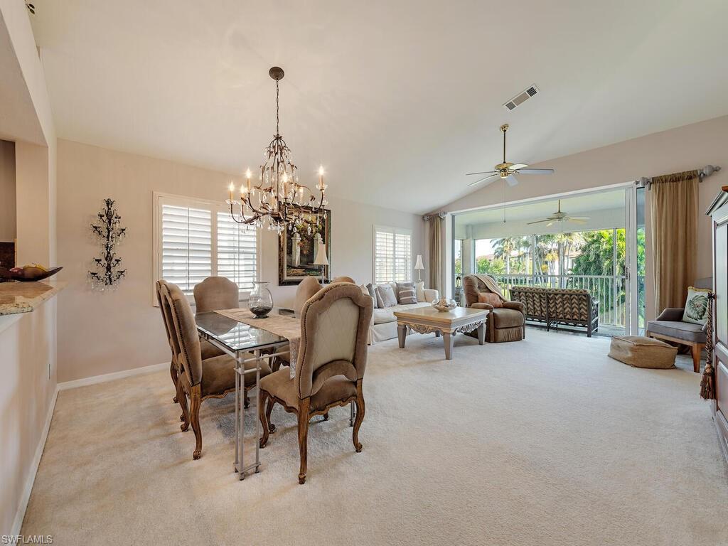 3572 Windjammer Circle, Unit 1404 Naples, FL 34112 - Photo 3 of 17 a view of a livingroom and a dining room with furniture window and outside view