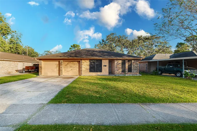 a front view of a house with a garden and porch