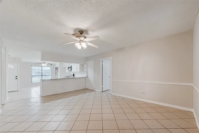 a view of a kitchen with a dishwasher and a cabinets with wooden floor