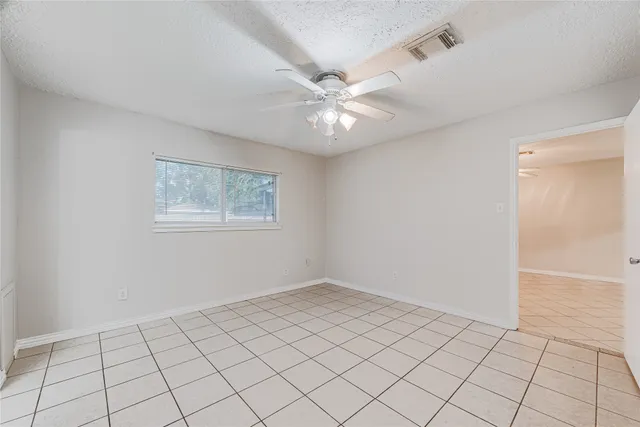 a view of an empty room and window