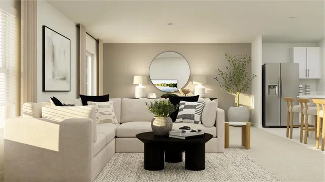 a living room with furniture a flat screen tv and a floor to ceiling window