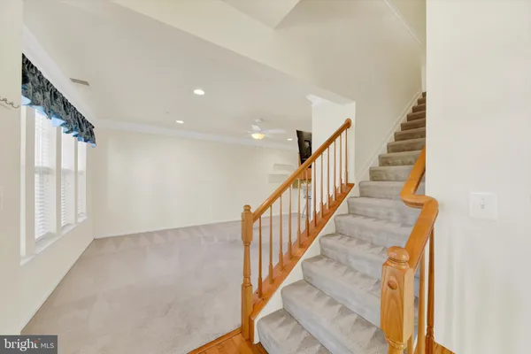 a view of staircase with wooden floor and staircase