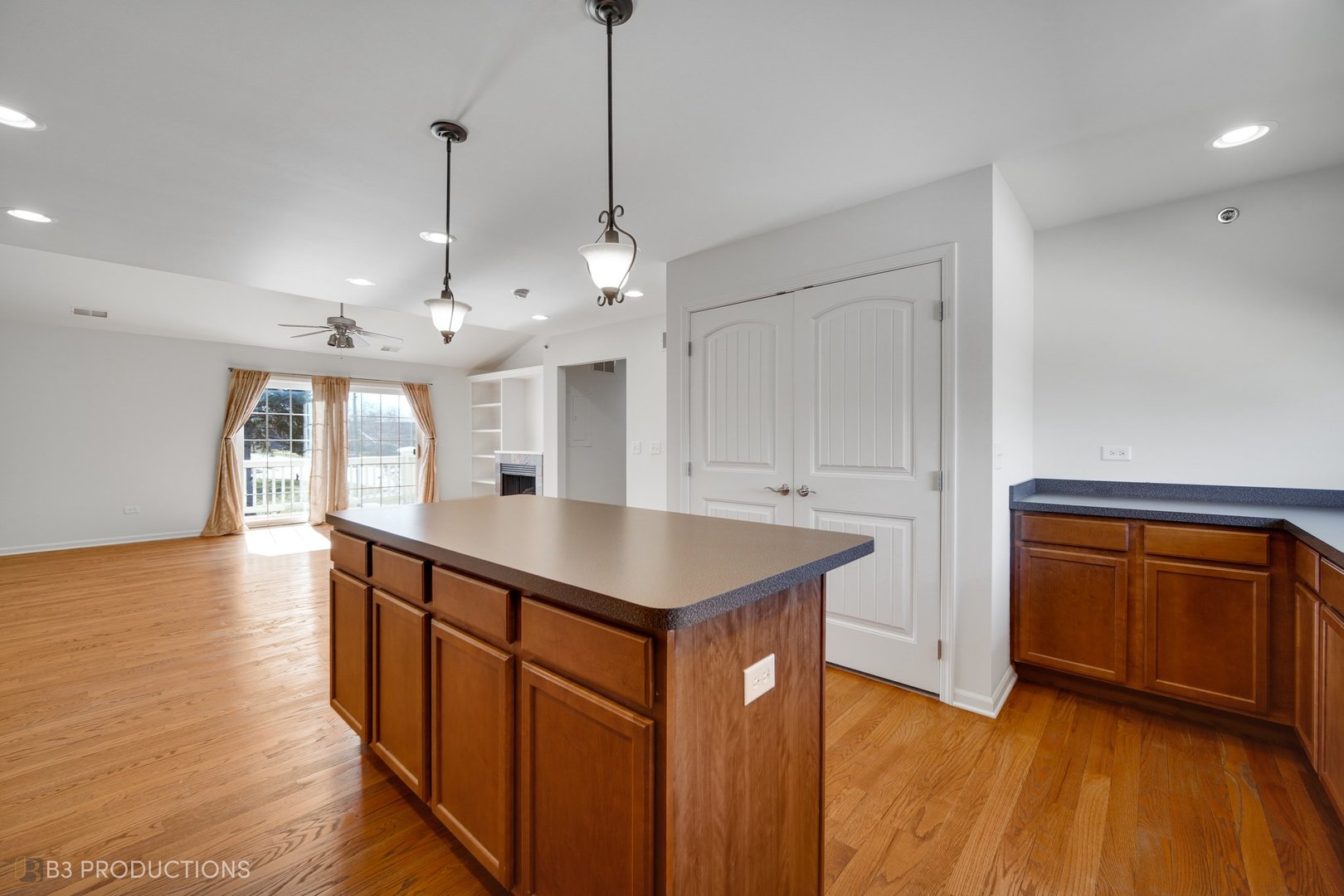 19235 Wolf Road, Unit 200 Mokena, IL 60448 - Photo 8 of 18 a kitchen with stainless steel appliances granite countertop a sink a stove and a wooden floors