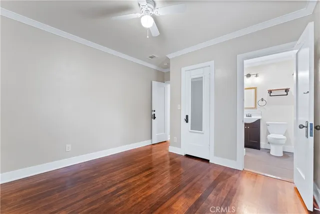 a view of livingroom with hardwood floor and a ceiling fan
