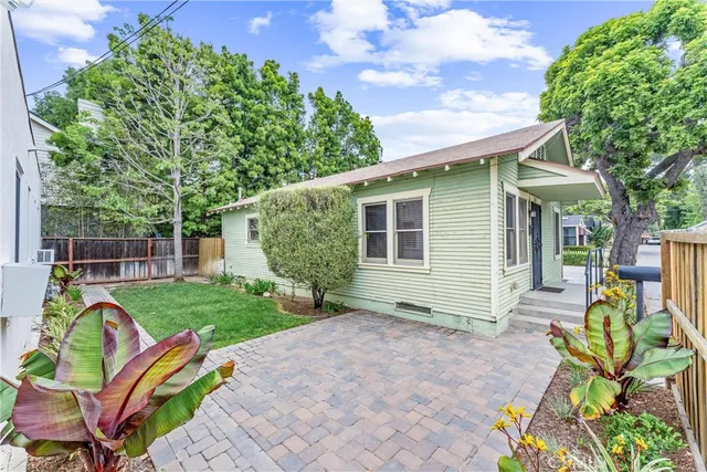a view of backyard with a patio
