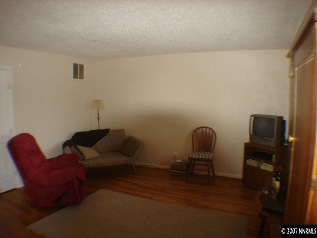 2735 Kings Row Reno, NV 89503 - Photo 3 of 9 a living room with furniture and a chair