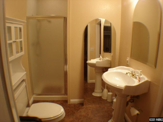 2735 Kings Row Reno, NV 89503 - Photo 6 of 9 a bathroom with a sink toilet and mirror