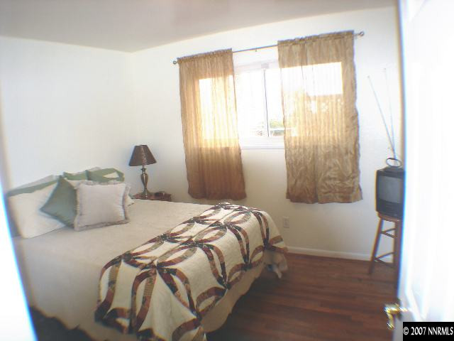 2735 Kings Row Reno, NV 89503 - Photo 8 of 9 a bedroom with a bed and a window