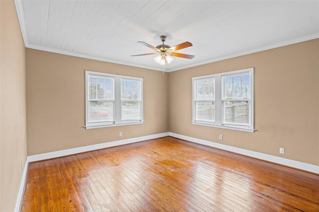 202 Gordon Street Rockmart, GA 30153 - Photo 12 of 25 a view of an empty room with window and wooden floor