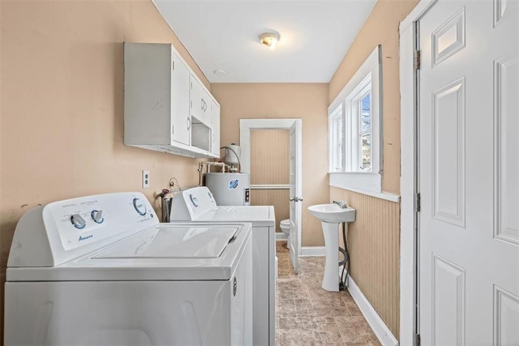202 Gordon Street Rockmart, GA 30153 - Photo 17 of 25 a view of washer and dryer with bathroom in the background