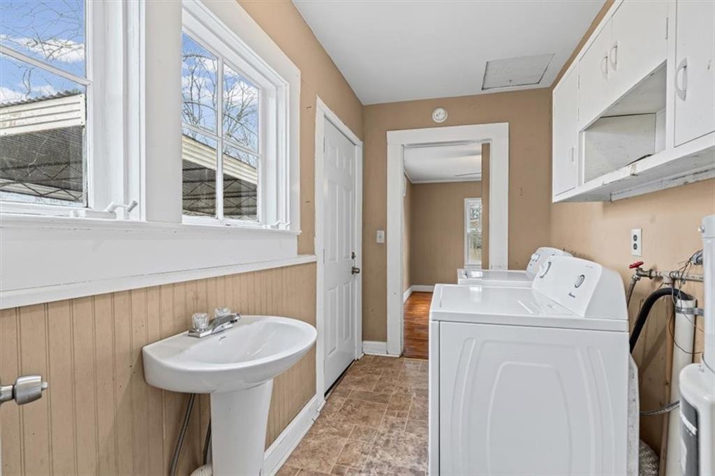 202 Gordon Street Rockmart, GA 30153 - Photo 18 of 25 a bathroom with a sink a window and a shower