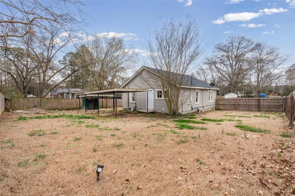 202 Gordon Street Rockmart, GA 30153 - Photo 19 of 25 a view of a house with a yard covered in snow