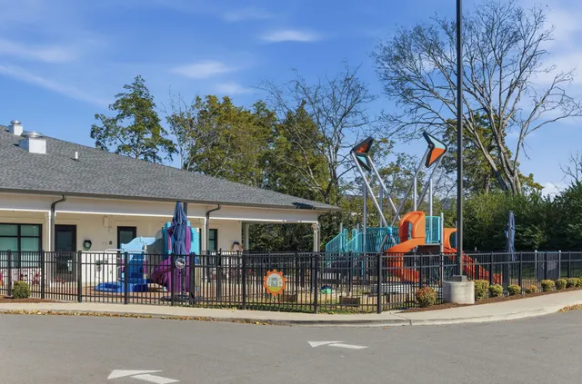 front view of a building with a parked car