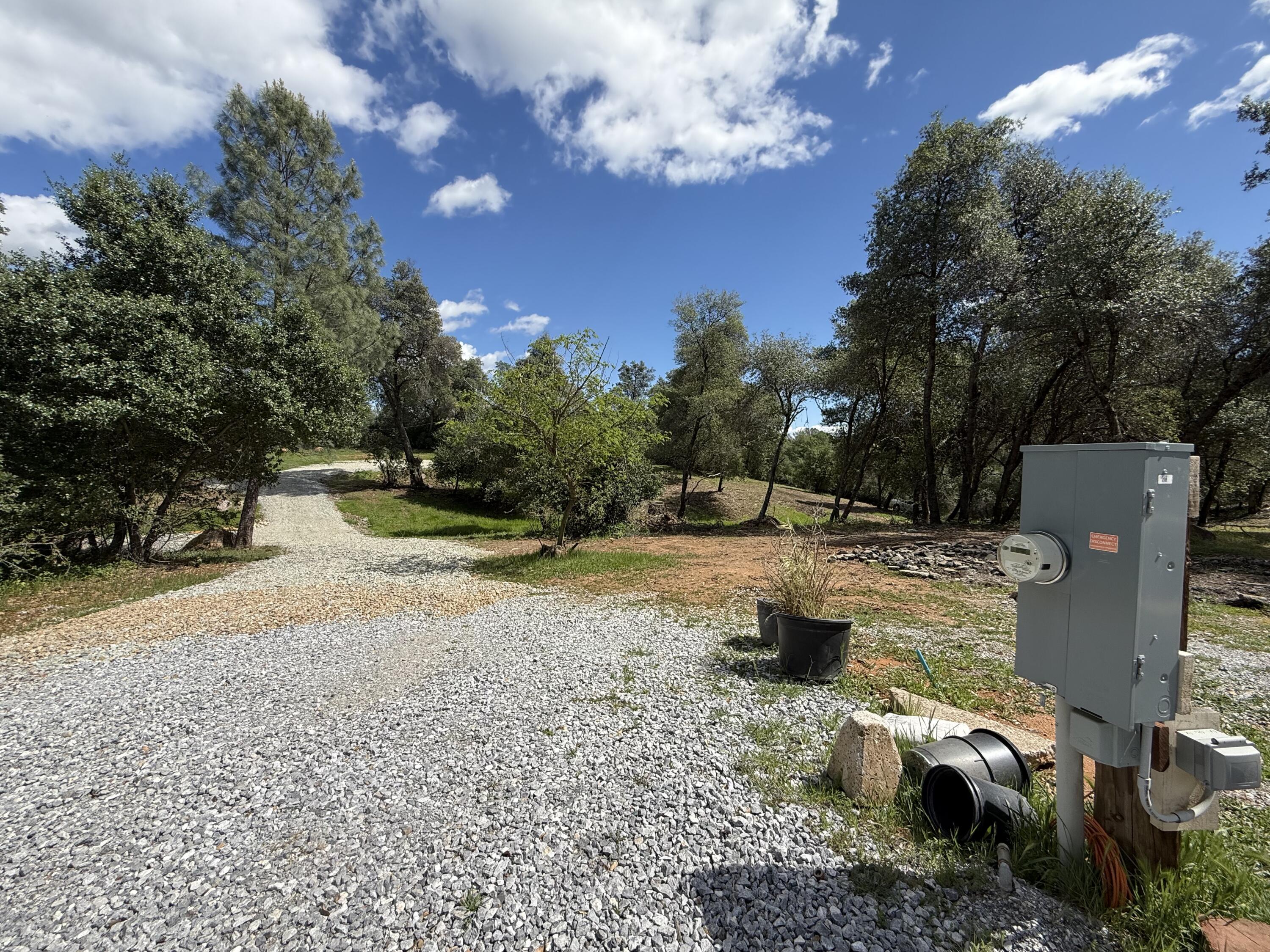 12333 Quartz Hill Road Redding, CA 96003 - Photo 12 of 21 a view of a fire pit with large trees