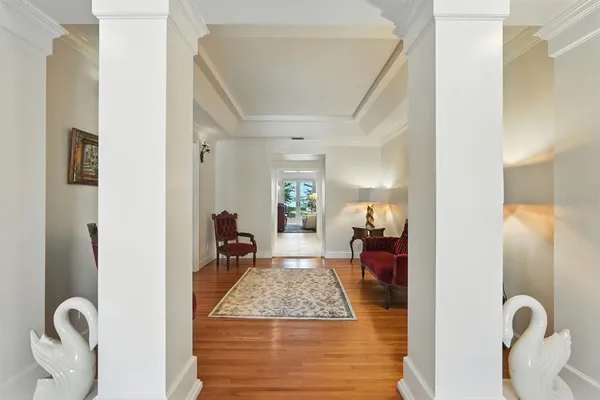a living room with furniture or kitchen view and a wooden floor