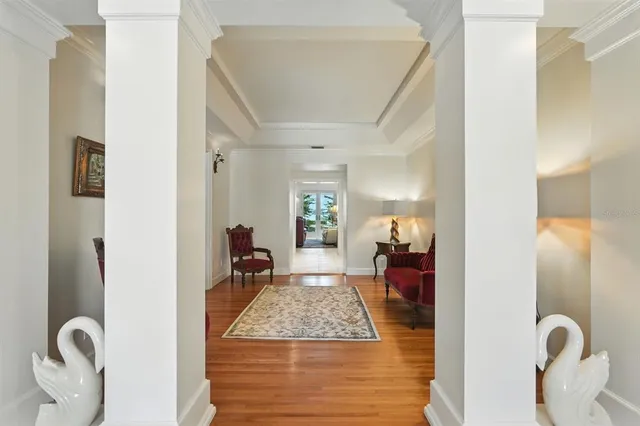 a living room with furniture or kitchen view and a wooden floor