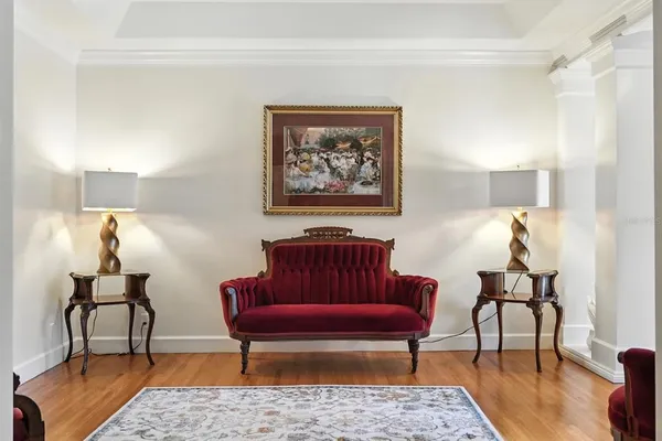 a living room with furniture and a gym