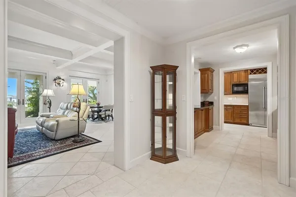 a view of a livingroom with a furniture wooden floor and a chandelier