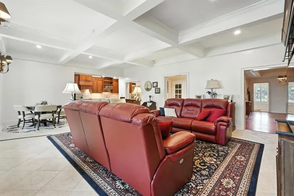 a living room with furniture and a rug