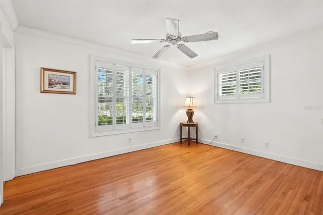 a bedroom with a bed window and a couch