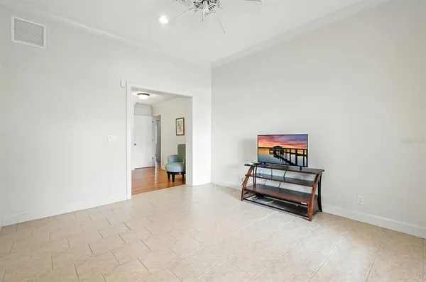 a spacious bedroom with a bed and a couch