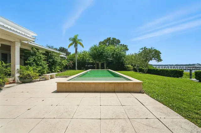 a view of a large body of water surrounded by trees