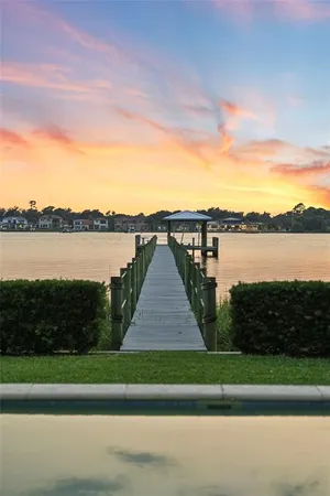 a living room with furniture rug and a table
