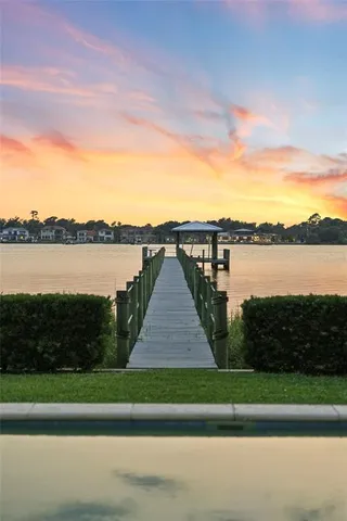 a living room with furniture rug and a table