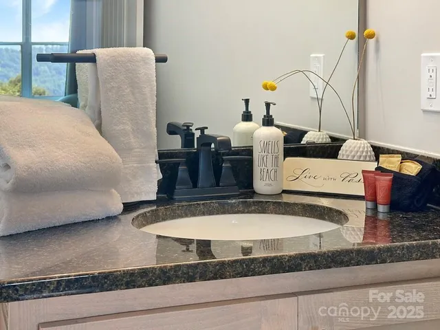 a bathroom with a sink toilet and tub